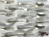 a lot of silver spoons and forks in a plastic bag