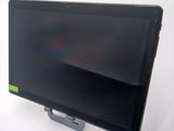 a tablet computer sitting on a stand on a white surface