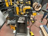 a picture of a machine that is working on a piece of wood