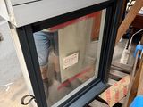 a man that is standing in front of a window