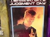 three dvds on the shelf of a store