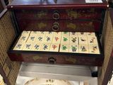 a wooden box with tiles in it on a table