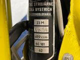 a close up of a person ' s hand on a yellow bike