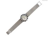 une image représentant une montre en argent ornée de pierres bleues