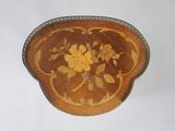 a small wooden box with a floral design on it