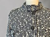a black and white jacket on a mannequin mannequin mannequin mannequin mannequin mannequin mannequin mannequin mann