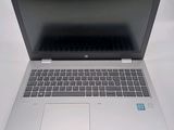 an open laptop computer sitting on top of a white table