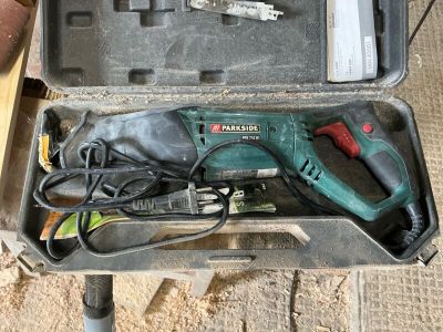 a tool in a case that is sitting on the ground