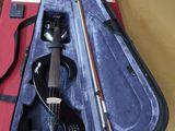 a violin that is sitting in a case on a table
