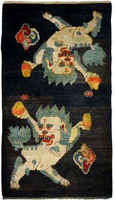 an oriental rug with two images of a demon and a demon on it