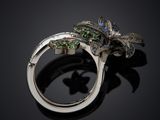 an image of a close up of a ring on a black surface