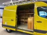 a yellow van that is parked inside of a building