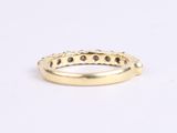 a close up of a gold ring on a white background