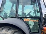 a tractor that is parked on the side of the road