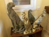 a small table with a bunch of silver figurines on top of it