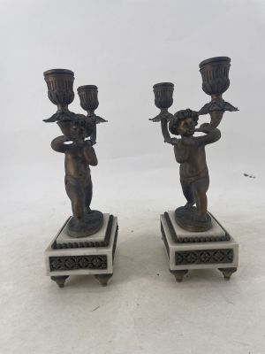 pair of antique bronze figurines on marble bases