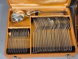a case that has a bunch of silverware inside of it