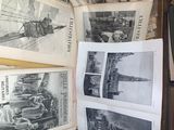 a lot of old newspapers that are stacked on a shelf