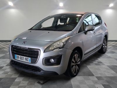 the small silver car is parked in a large room