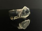 an image of a watch sitting on top of a black table