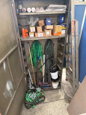 a small storage area with a lot of items in it