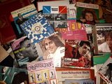 a pile of magazines on the floor of a room