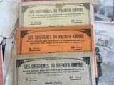 several different types of french currency are on a table