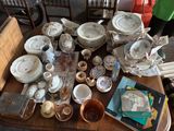 a table with a lot of dishes and plates on it
