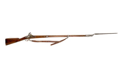 an old rifle with a long wooden handle and a long wooden handle