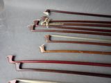 many different types of wooden canes on a table