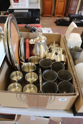 a box full of silverware sitting on a table