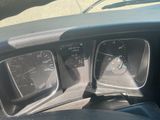 a close up of the dashboard of a car with the gauges on