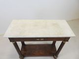 an antique marble topped table with a shelf underneath it