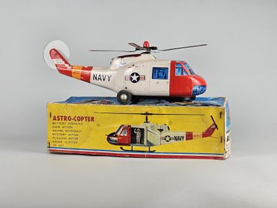 a toy helicopter sitting on top of a box