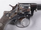 a close up of a gun on a white surface