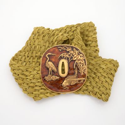 a belt buckle with a picture of a bird on it