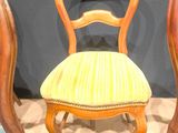 two chairs that are next to each other on the floor