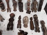 a lot of wooden figurines sitting on a table
