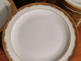 a lot of plates that are sitting on a table