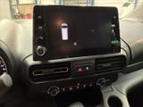 an image of a car dashboard with a cell phone in the center