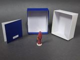 a small figurine that is sitting in a box