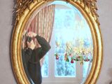 a man taking a picture of himself in a mirror