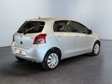 a picture of a silver car parked in a showroom