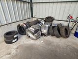 a pile of tires and other items in a garage