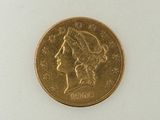 an image of a gold coin with a woman ' s head on it
