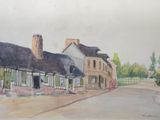a watercolor painting of a street in a town