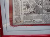 a picture of a picture of a newspaper in a red frame