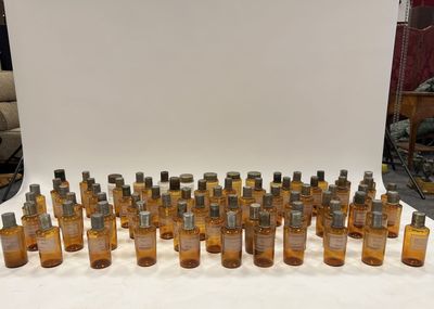 an image of a group of bottles of perfume sitting on a table