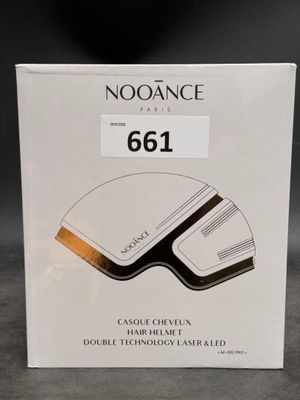 an image of a white box with a black and gold logo
