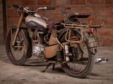 a motorcycle that is parked in front of a brick wall